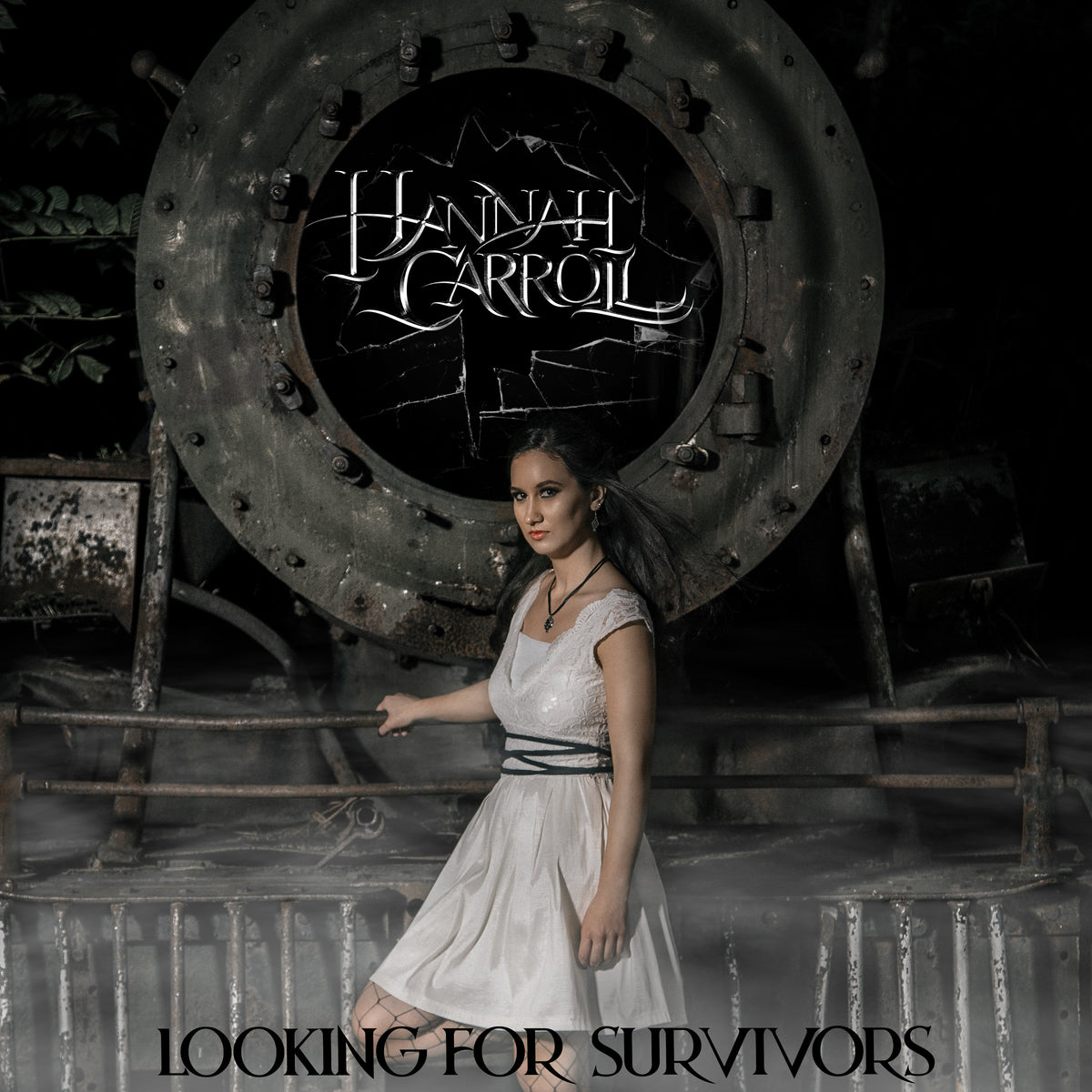 Looking for Survivors cover art shows Hannah Carroll in white dress holding onto corroded metal railing in an abandoned building